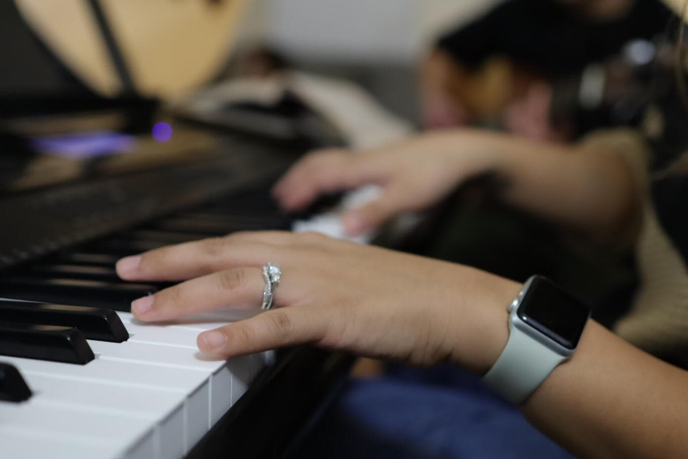 Ambergrace's hands at the piano keys